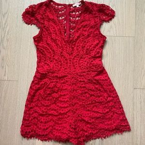 Red lace romper with v-neck and open lace back